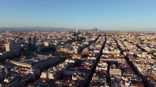 Drone View of the Quarters of Madrid Illuminated By the Sun Against a Clear Sky