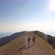 Drone view of two friends hiking in the Apennines, Umbria, Italy - VideoHive Item for Sale