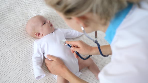 Doctor With Newborn. Physical Examination. Doctor Home Visits