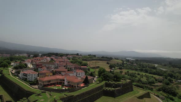 Aerial view of ancient fortress walls and village of Valença do Minho on sunny day. Border Portugal