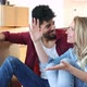 Young Happy Couple Moving in New Home and Unpacking Boxes - VideoHive Item for Sale