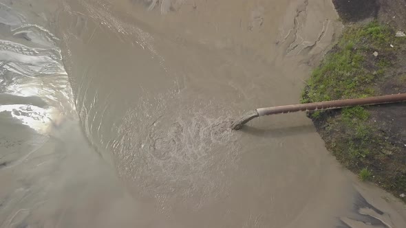 Aerial Video of an Ash Dump. The Pipeline From Which the Products of Coal Combustion Are Discharged