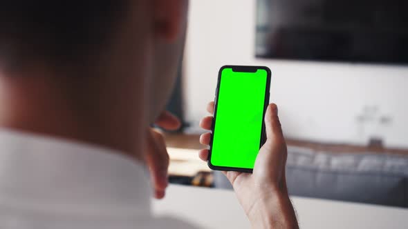 Human Arms Hold Electronics Gadget with Chromakey Touchpad Closeup. Guy Gesturing: Scrolling App By