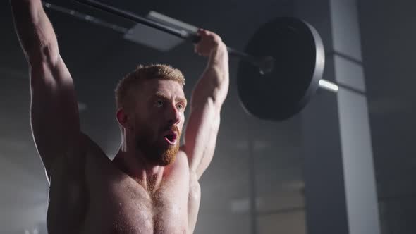 Slow Motion of Crossfit Athlete Performs Clean and Jerk