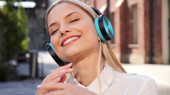 Smiling Young Girl Listening Music Outdoors Dancing Using Mobile Phone App