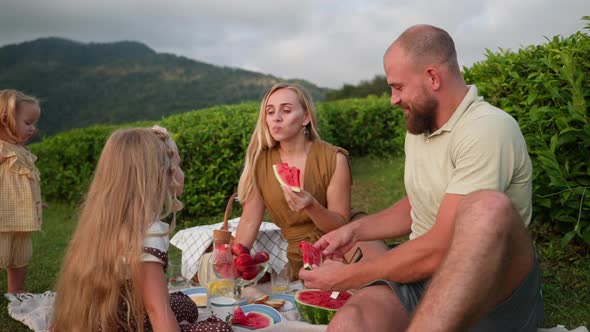 Family Spending Weekend Together and Having a Picnic