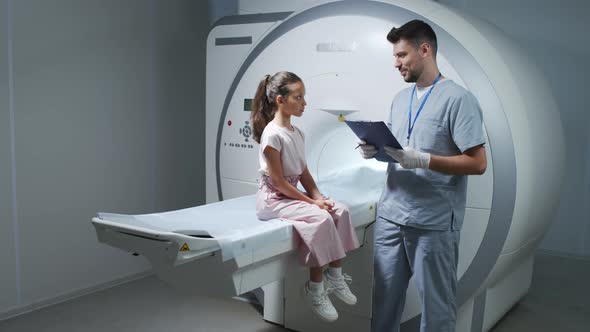 Girl Listening to Doctor before MRI Examination