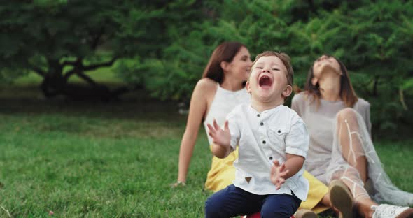 Very Cute Two Years Boy Make Funny Faces in Front