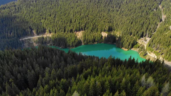 Mountain lake with turquoise water and green trees. Mountains, forest and lake.