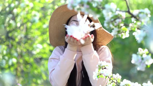 Beauty Young Woman Enjoying Apple Blooming Spring Orchard.