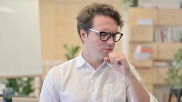 Portrait of Sick Young Man Coughing