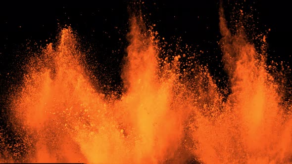 Super Slowmotion Shot of Orange Powder Explosion Isolated on Black Background at 1000Fps