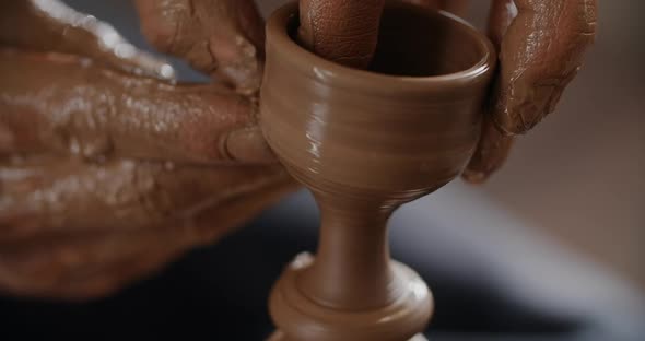 MACRO SHOT Potter Sculpts a Small Ceramic Glass in Slow Motion on a Potter's Wheel Small Forms in