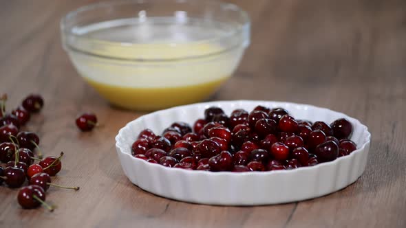 Baked red cherry clafoutis with cream