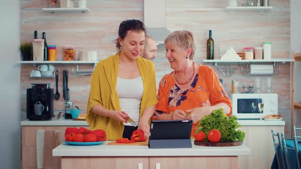 Women Cooking Using Tablet