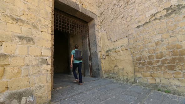 Male Tourist Entering Medieval Castel Dell'Ovo, Sightseeing in Naples, Tourism