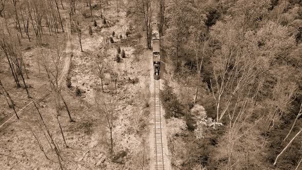 Black and White Aerial View of an 1860's Steam Passenger Train Traveling