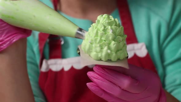 A Woman Makes Cones From Marshmallows.