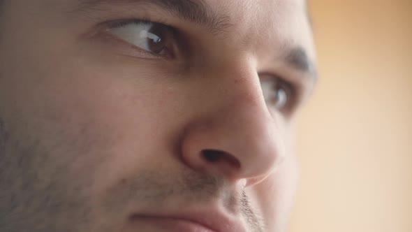 Close-Up Of The Eyes And Face Of A Young Man Working At A Computer.