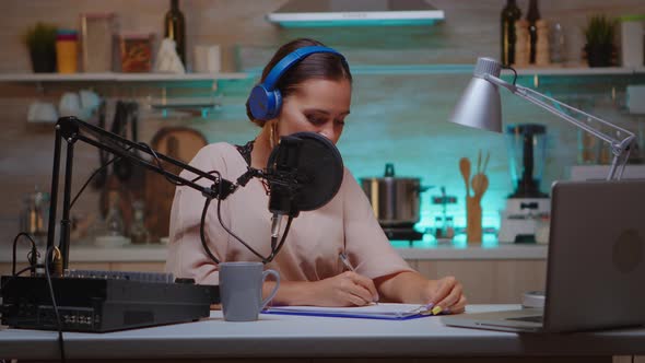 Influencer Taking Notes on Clipboard