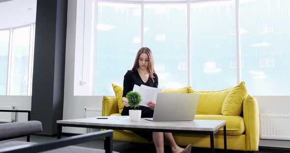 Concerned Woman Working and Thinking Solving Problem at Office. Serious Attractive Female Working