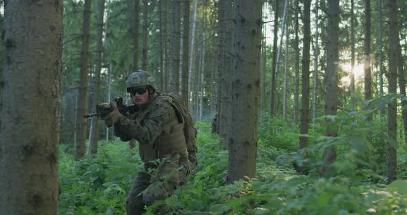 Equipped Soldiers Moving Through Smokey Forest