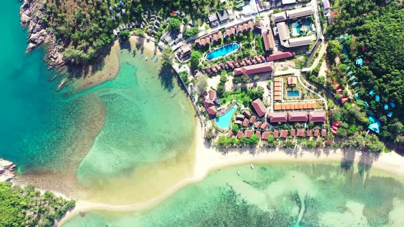 Aerial top view travel of idyllic lagoon beach holiday by blue ocean and white sandy background of a