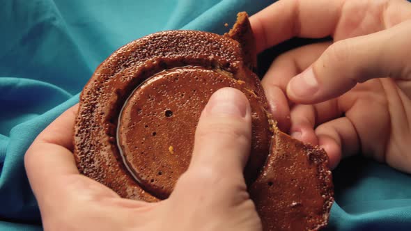 Men's Hands Break Sugar Cookies Candy in the Shape of a Circle