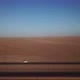 Car Parked on Asphalt Road in Aerial Desert - VideoHive Item for Sale