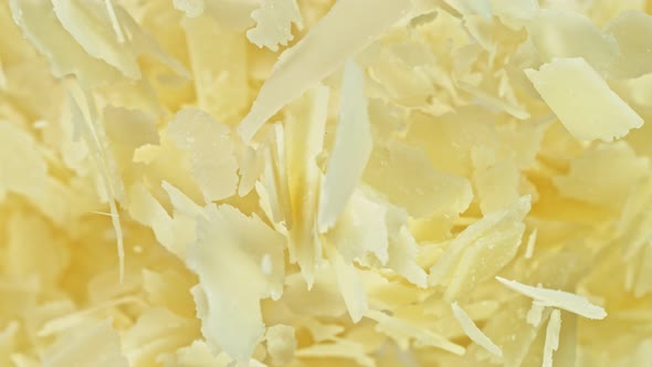 Super Slow Motion Detail Shot of Flying Parmesan Shavings at 1000 Fps