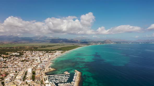 Aerial drone footage of the beach front on the Spanish island of Majorca Mallorca, Spain