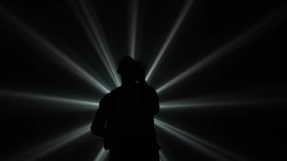 Young Couple Dancing Latin Music. Bachata, Merengue, Salsa. Shot in a Dark Studio with Neon Lights