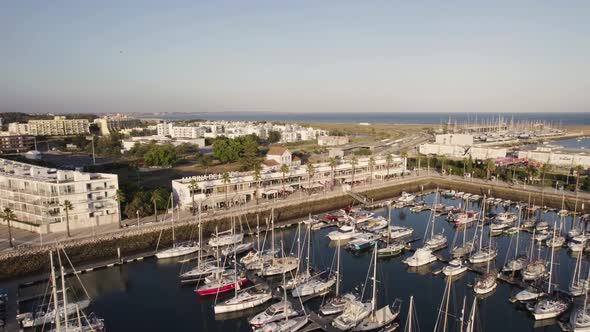 Algarve, Lagos marina, moored yachts and luxury lifestyle. Aerial view