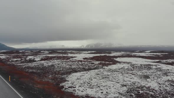 Aerial view of road in terrain snowy