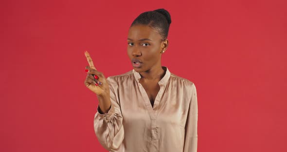 Studio Portrait Afro American Woman Black Mixed Race Girl Standing on Red Background Shaking Her