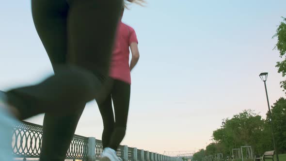 A Group of Girls Jogging in the Morning Along the Promenade.