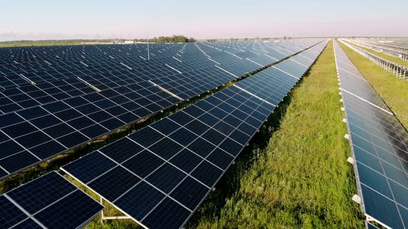 Close Up Solar Power Station Panels in a Row in the Fields Green Energy at Sunset Landscape