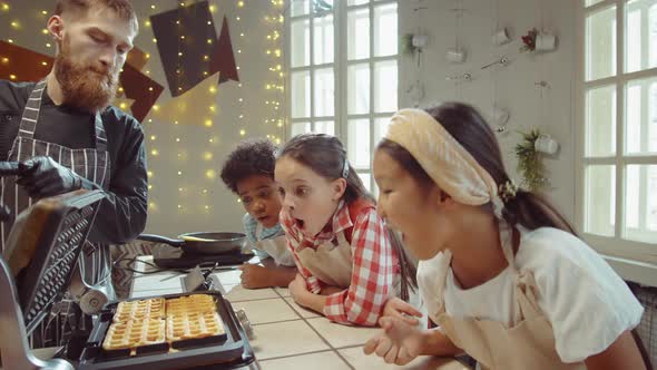 Excited Kids Looking at Waffles on Cooking Masterclass