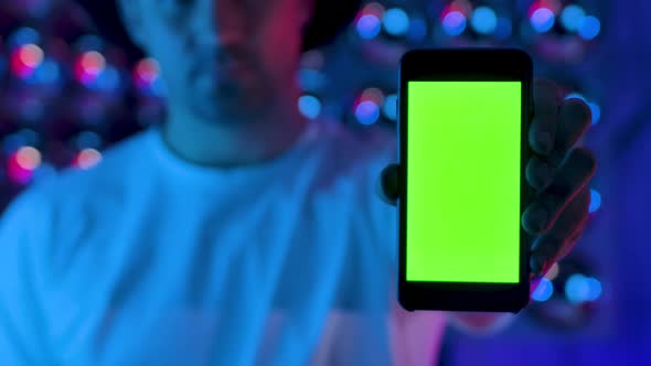 Man Using Hand Smartphone Presents Green Screen Chroma Key Vertical Display Glow