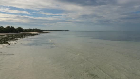 Sea shore and African life in the turquoise sea of Zanzibar