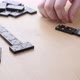 Caucasian husband and wife with Parkinson's disease play dominoes. - VideoHive Item for Sale