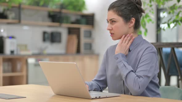 Indian Woman Having Neck Pain While Using Laptop