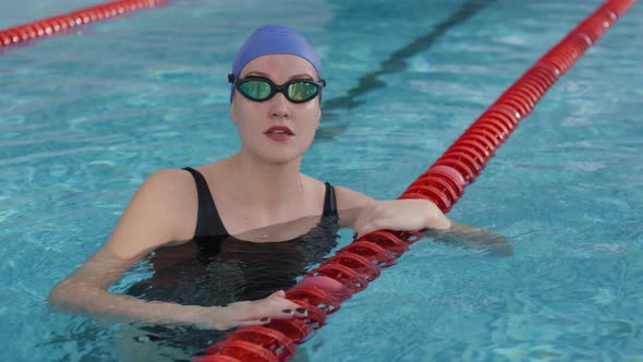 Portrait of Female Swimmer Floating in Pool