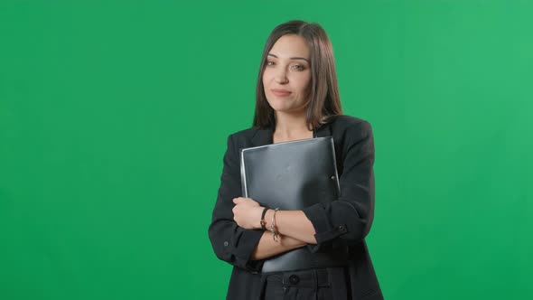 Portrait of Young Happy Smiling Businesswoman with Black Folder, Isolated Against Green Screen