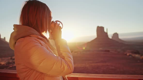 Scenic Sunrise in Monument Valley Woman Enjoying Peaceful Morning with Coffee