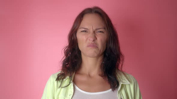 Portrait of Young Woman with Thumbs Down