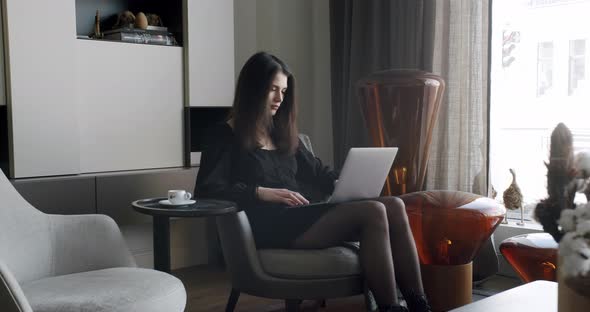 Young Adult Business Woman Typing on Laptop Computer Working in Internet