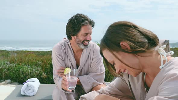 Couple relaxing on patio