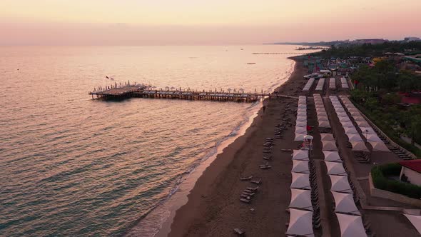 Arial View To Luxury Resort and Coastline at Sunset.