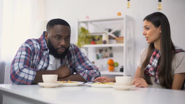 Multiethnic Couple Arguing During Lunch at Home, Angry Woman Goes Away, Break-Up